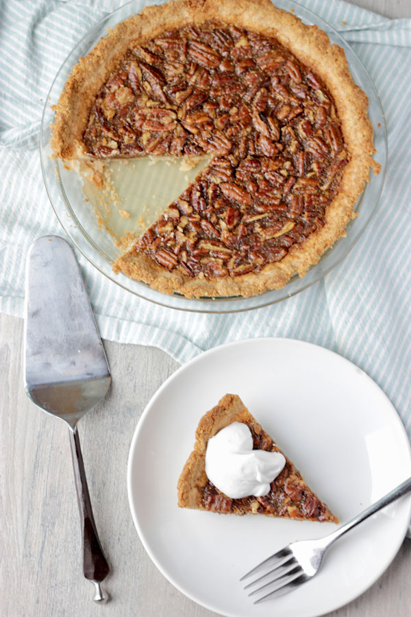 Pecan pie on cooling rack and slice 