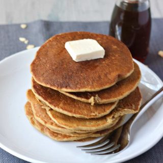 Stack of vegan oatmeal blender pancakes on a plate.