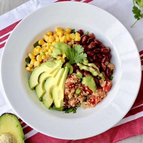 Vegan Mexican quinoa bowl with cilantro lime dressing.