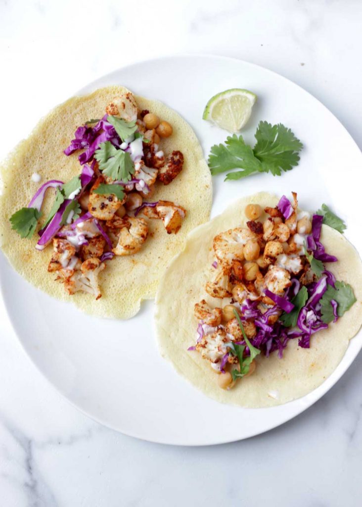 Chickpea cauliflower tacos on a white plate
