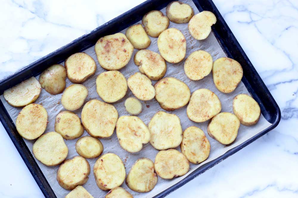 Potato slices on a sheet pan