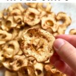 Oven baked apple chip with cinnamon on top.