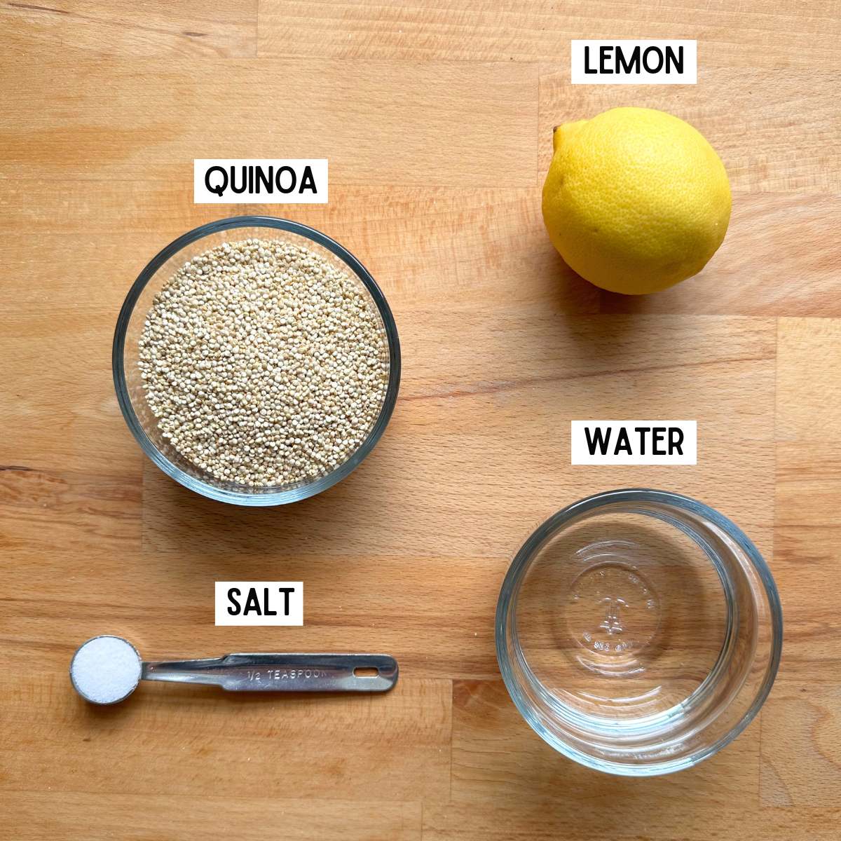 Ingredients needed to make lemon quinoa with corresponding labels: quinoa, lemon, salt, and water.