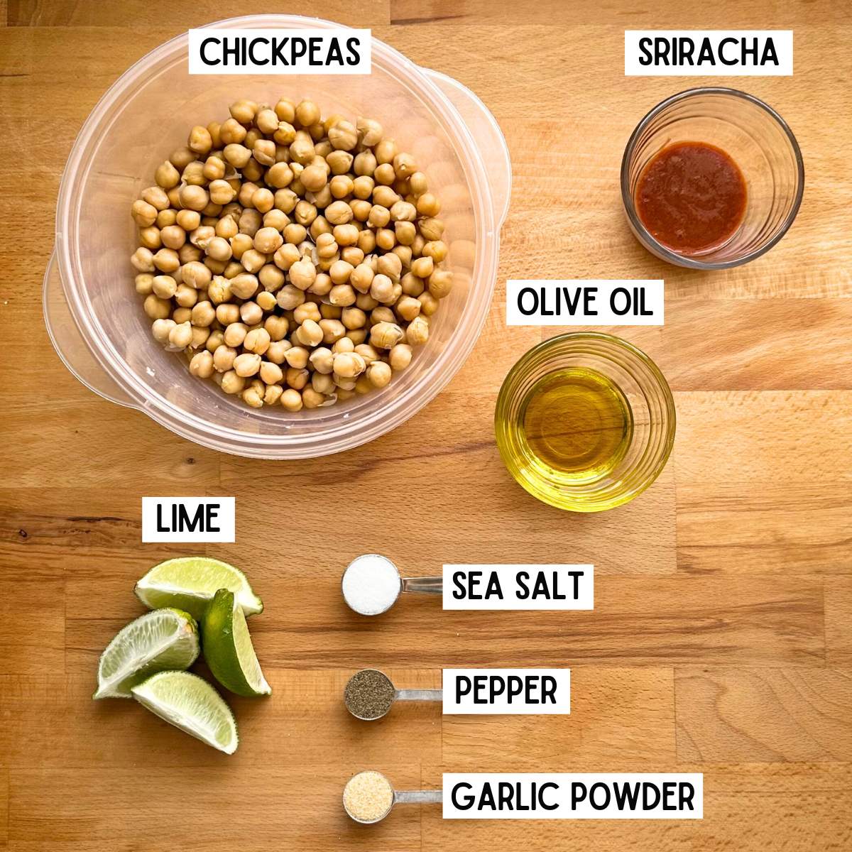 Ingredients needed to make sriracha lime chickpeas with corresponding labels: chickpeas, sriracha, olive oil, lime, sea salt, pepper, and garlic powder.