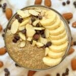 Almond butter chia pudding topped with sliced banana, almonds, and chocolate chips.