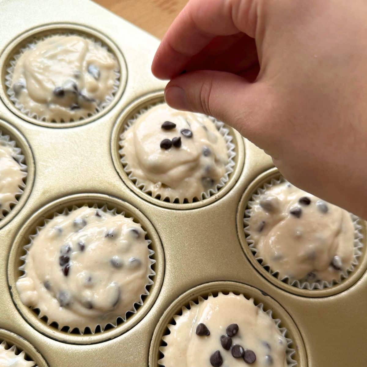 Sprinkling mini chocolate chips over the batter.