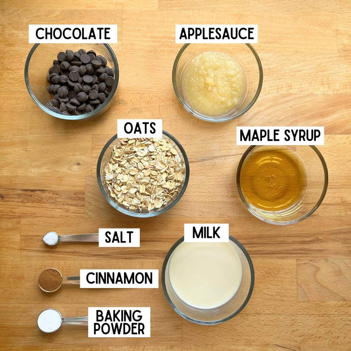 Ingredients with corresponding labels: chocolate, applesauce, oats, maple syrup, milk, salt, cinnamon, and baking powder.