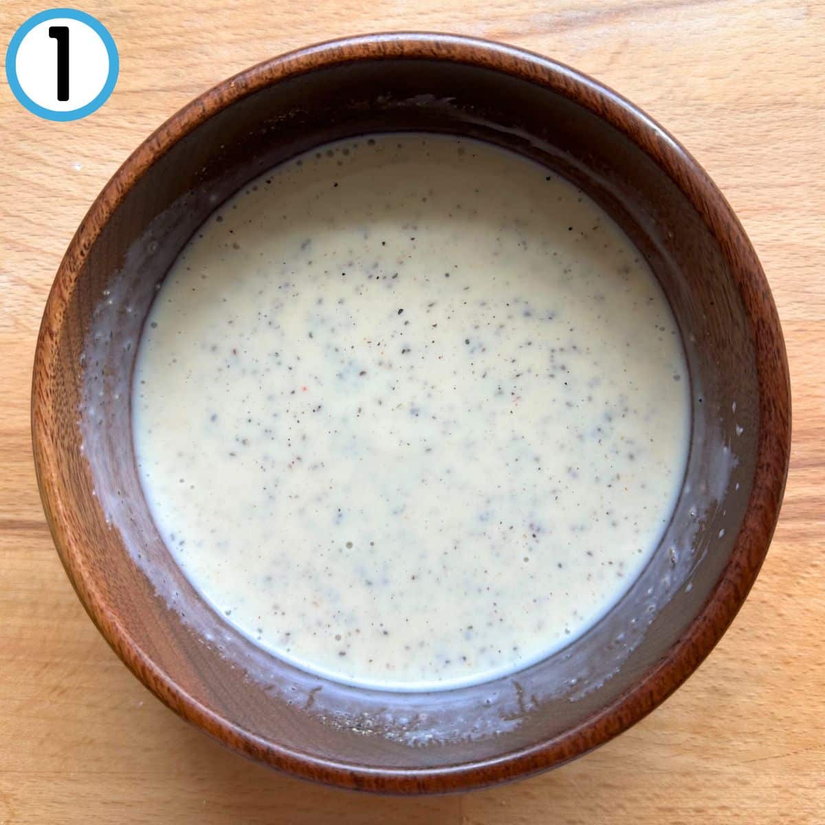 Coleslaw dressing mixed together in a bowl.