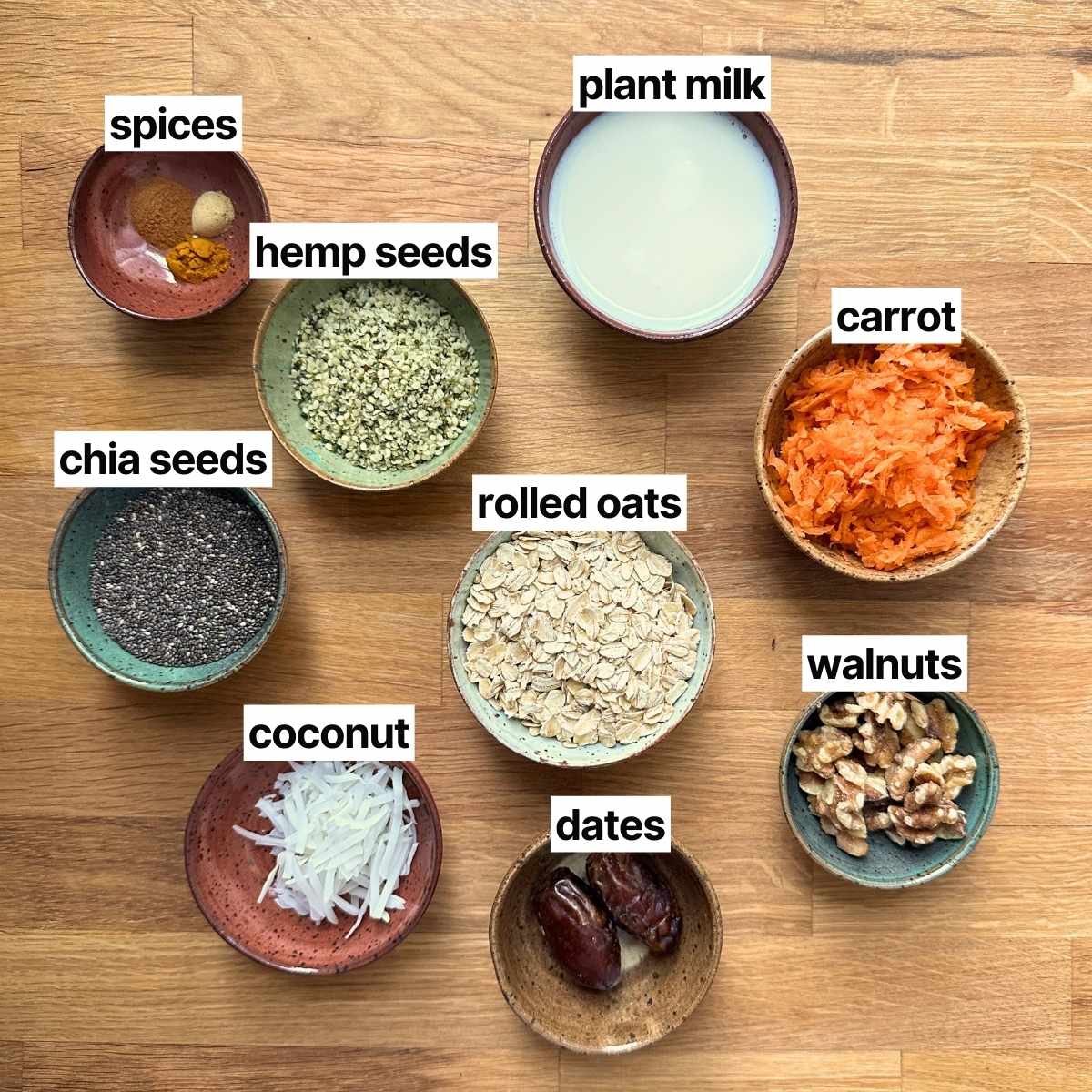 Ingredients needed to make carrot cake oatmeal with labels.