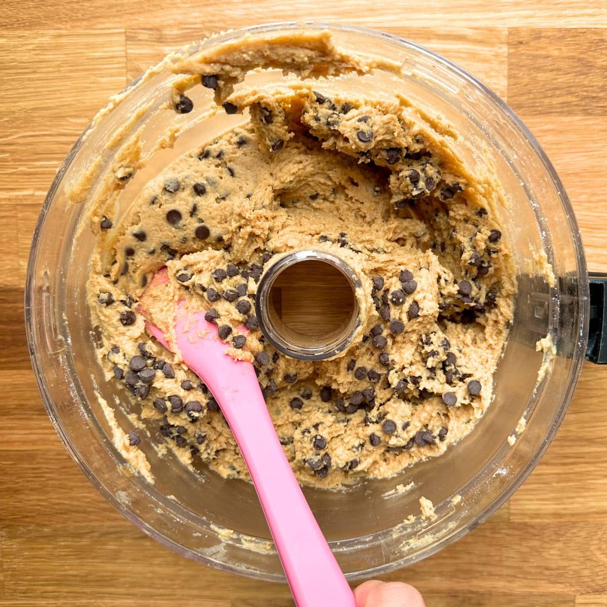 Folding chocolate chips into the chickpea cookie dough.
