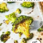 Smashed broccoli on a fork with text that read "crispy smashed broccoli florets".