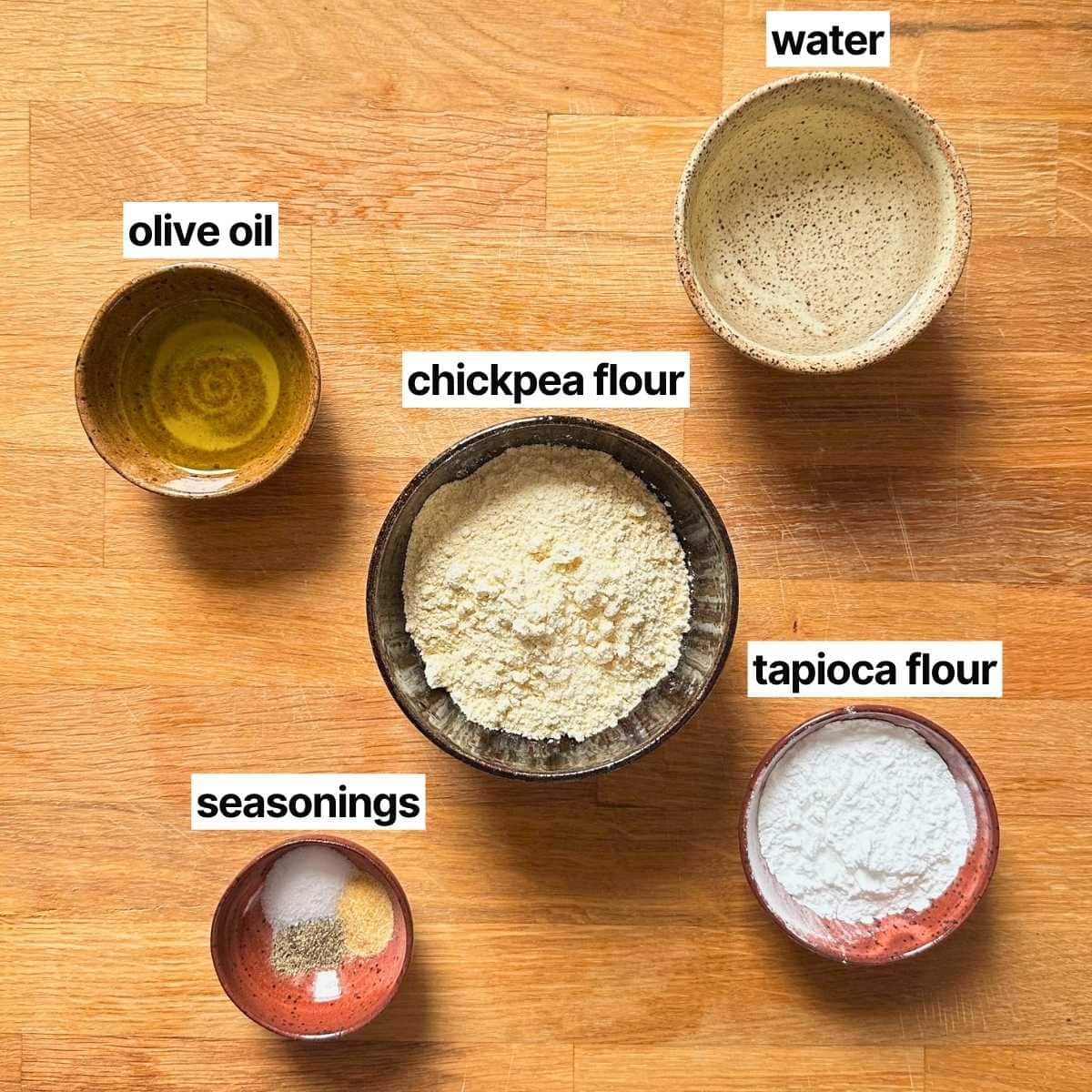 Ingredients to make chickpea tortilla chips with corresponding labels: water, olive oil, chickpea flour, tapioca flour, and seasonings.