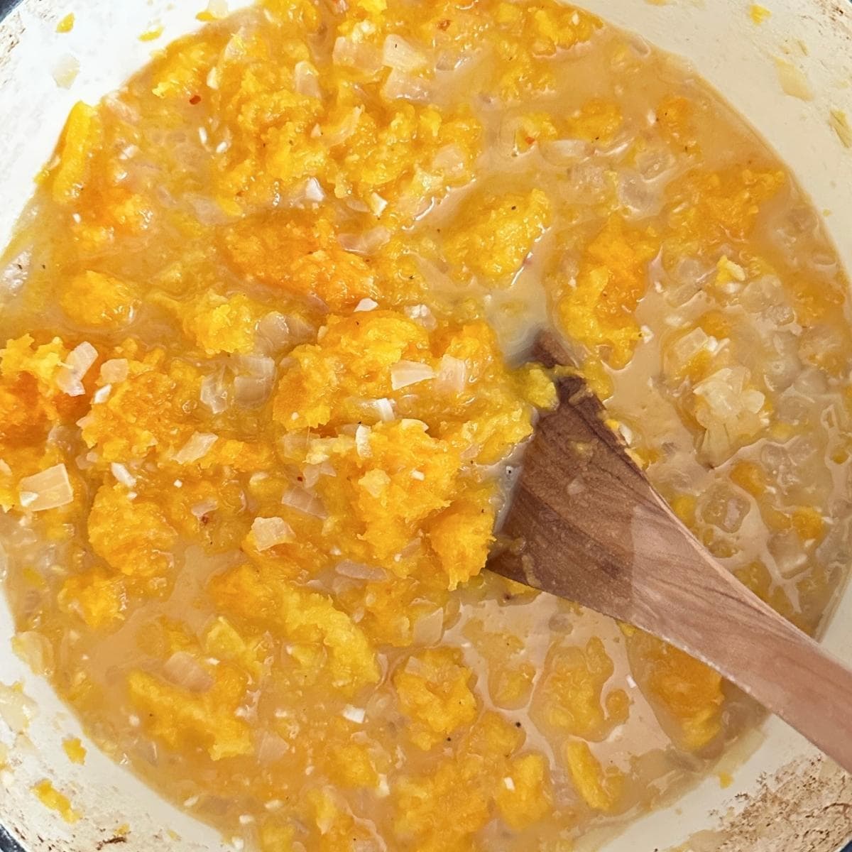 Roasted butternut squash added to  the pot with coconut milk and broth.
