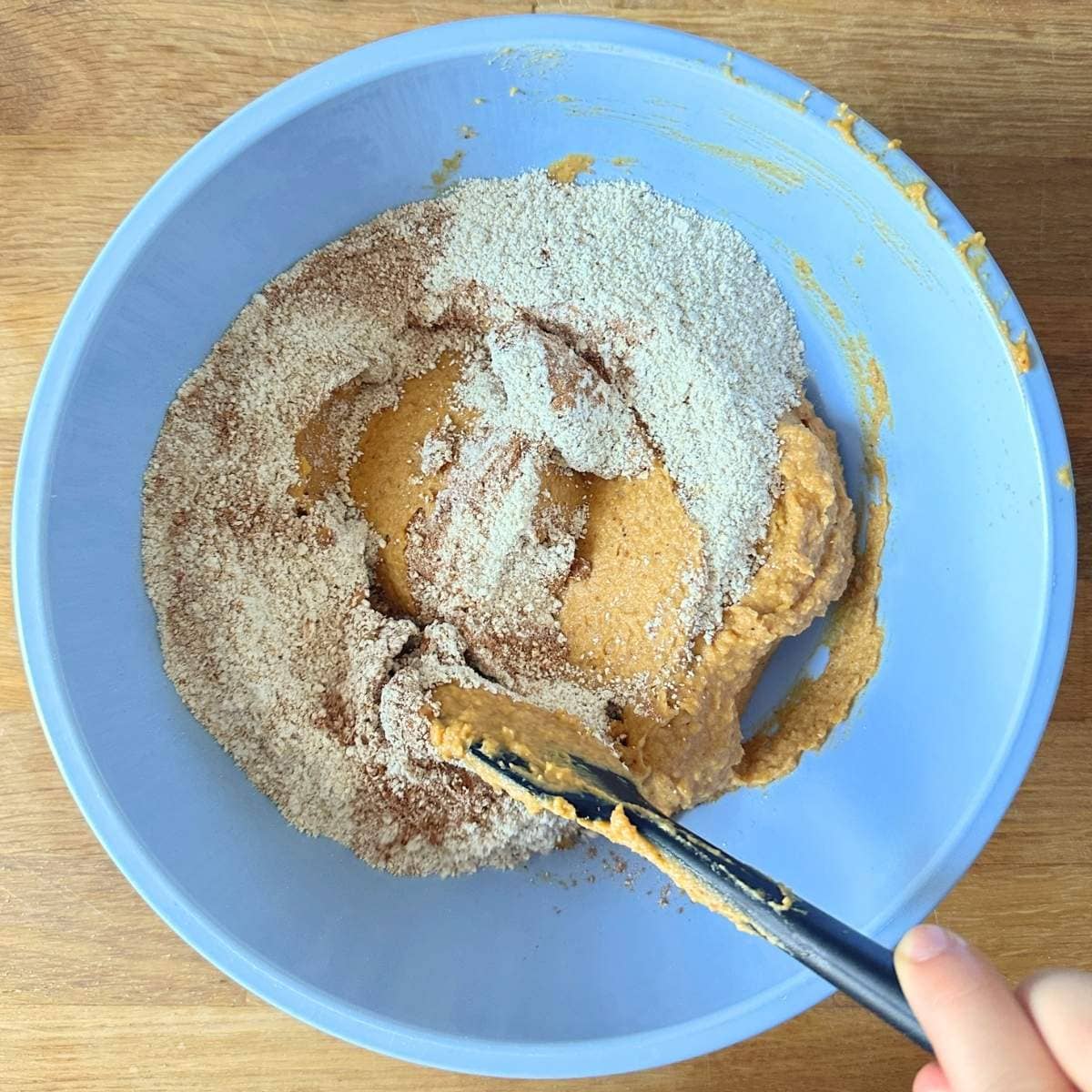 Combining oat flour with the chickpea pumpkin batter.