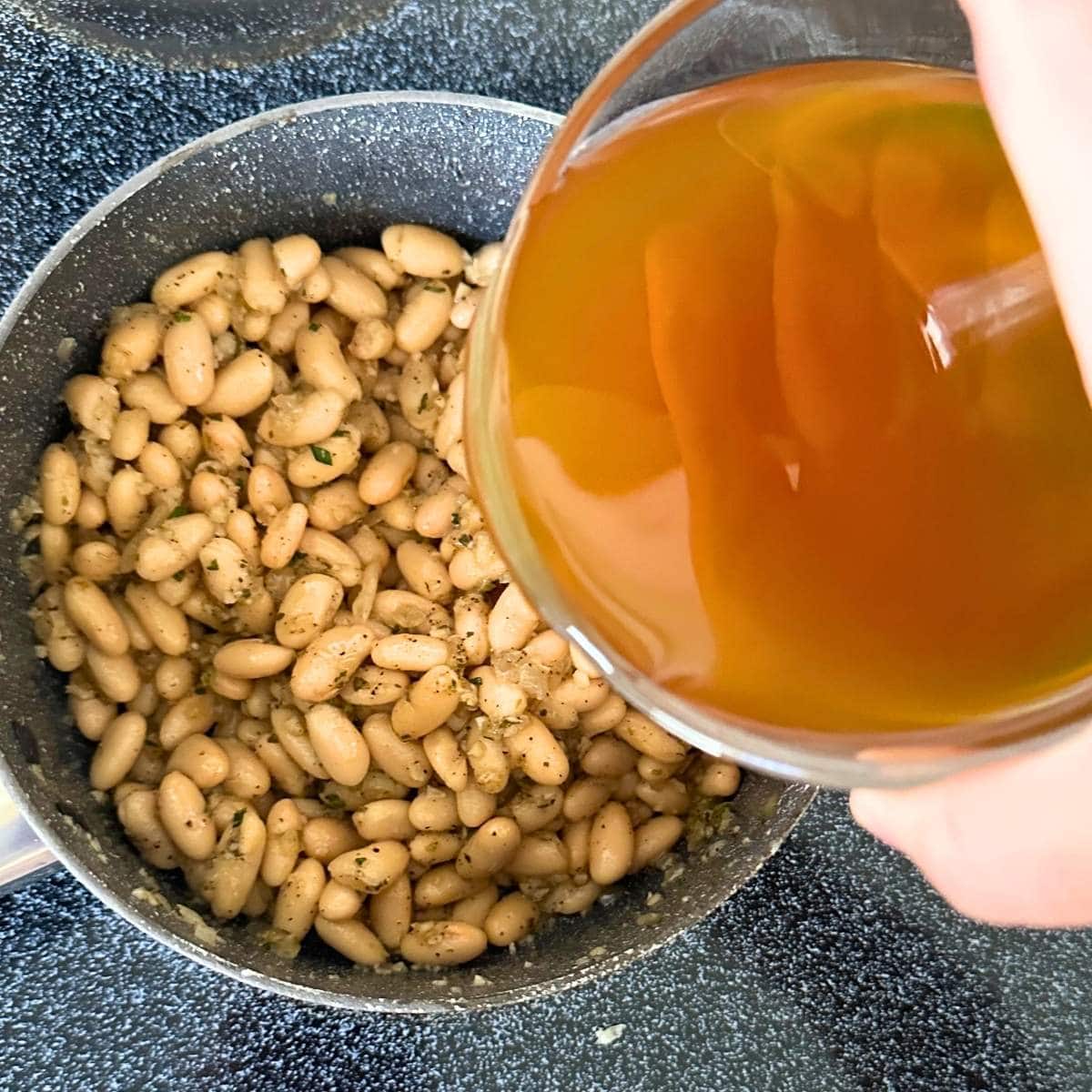 Add white beans and vegetable broth to the base.