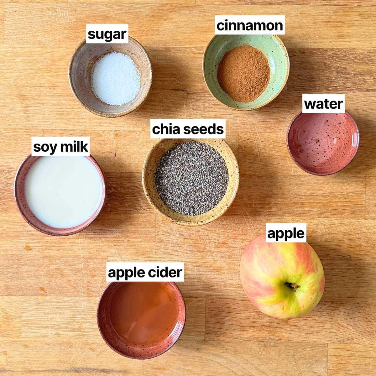 Ingredients for apple chia pudding with labels: sugar, cinnamon, soy milk, chia seeds, water, apple cider, and apple.