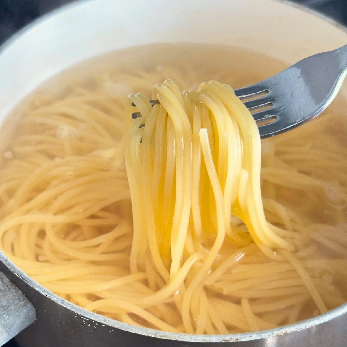 Cooked spaghetti in a pot.
