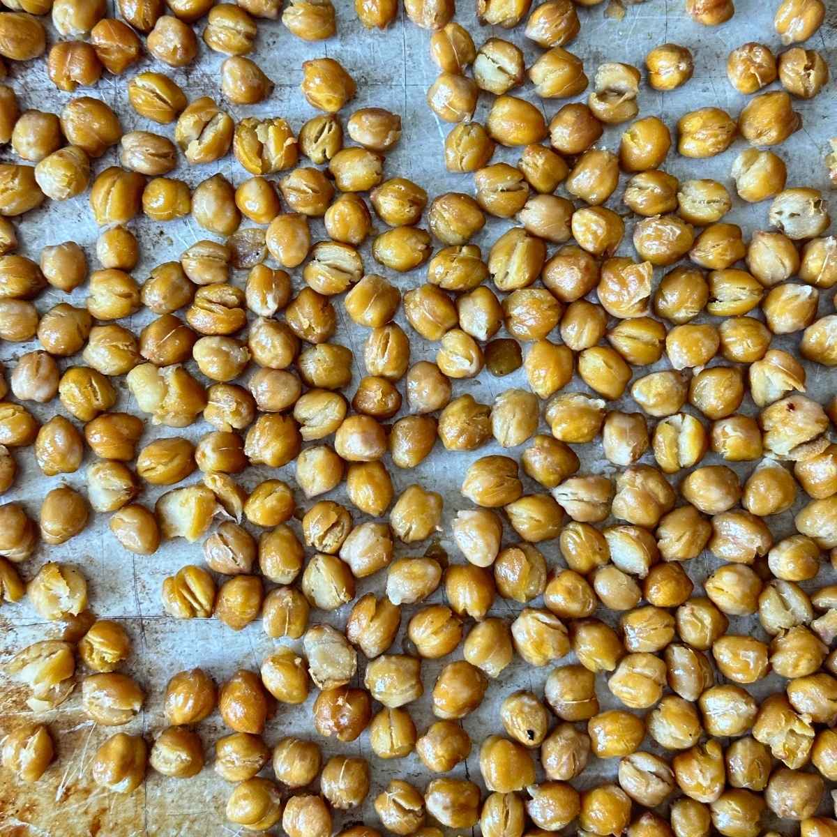 Roasted chickpeas on a pan.