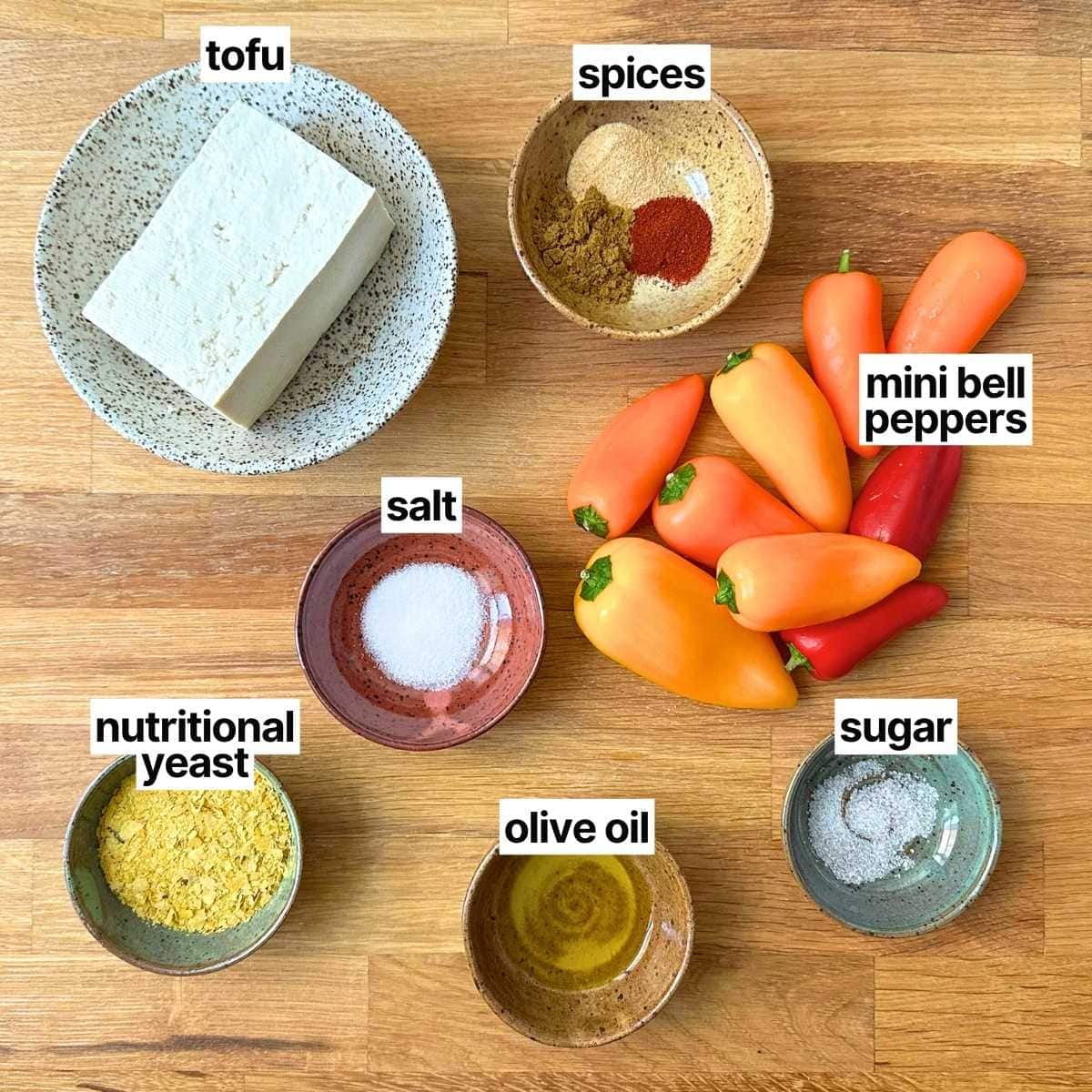 Ingredients with labels: nutritional yeast, tofu, salt, olive oil, spices, sugar, mini bell peppers.