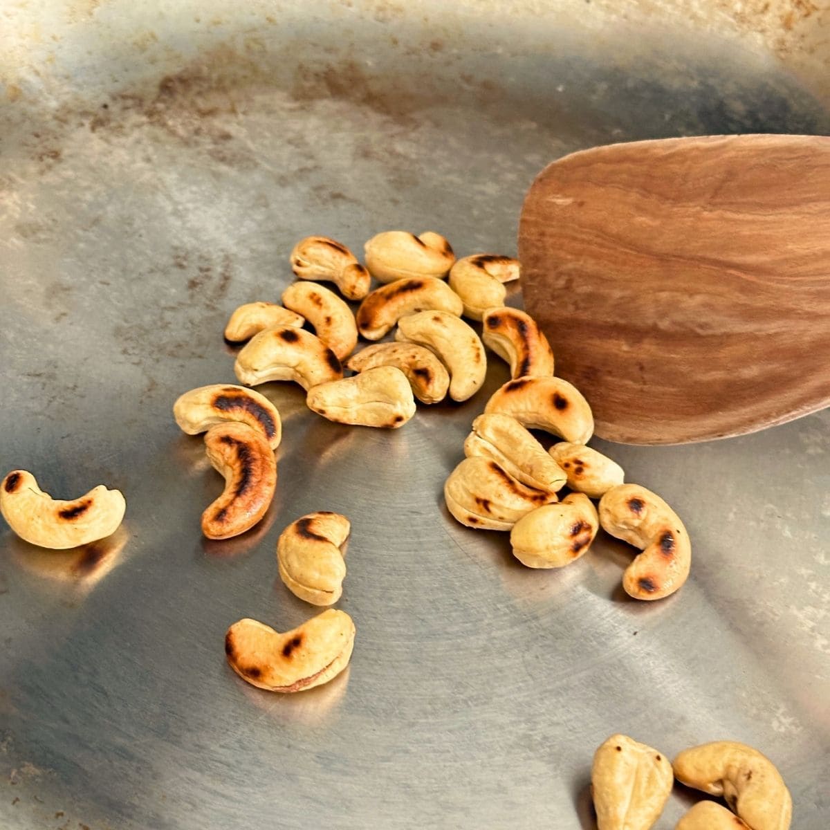 Pan roasting cashews.