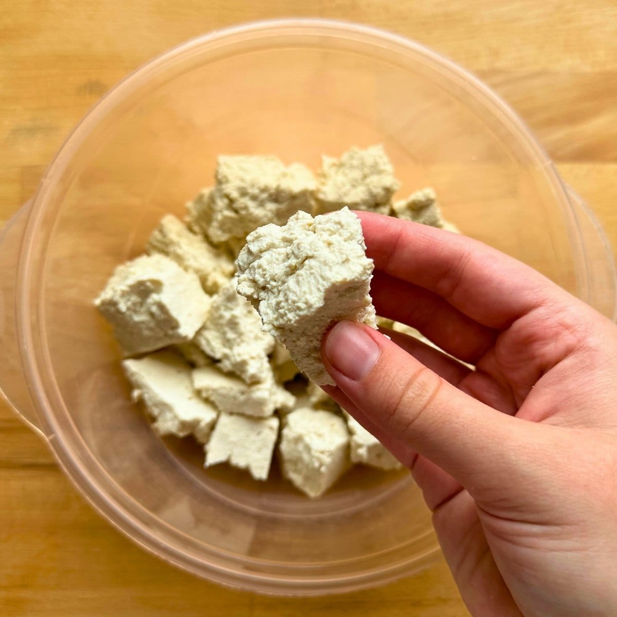 Rip tofu into chunks.