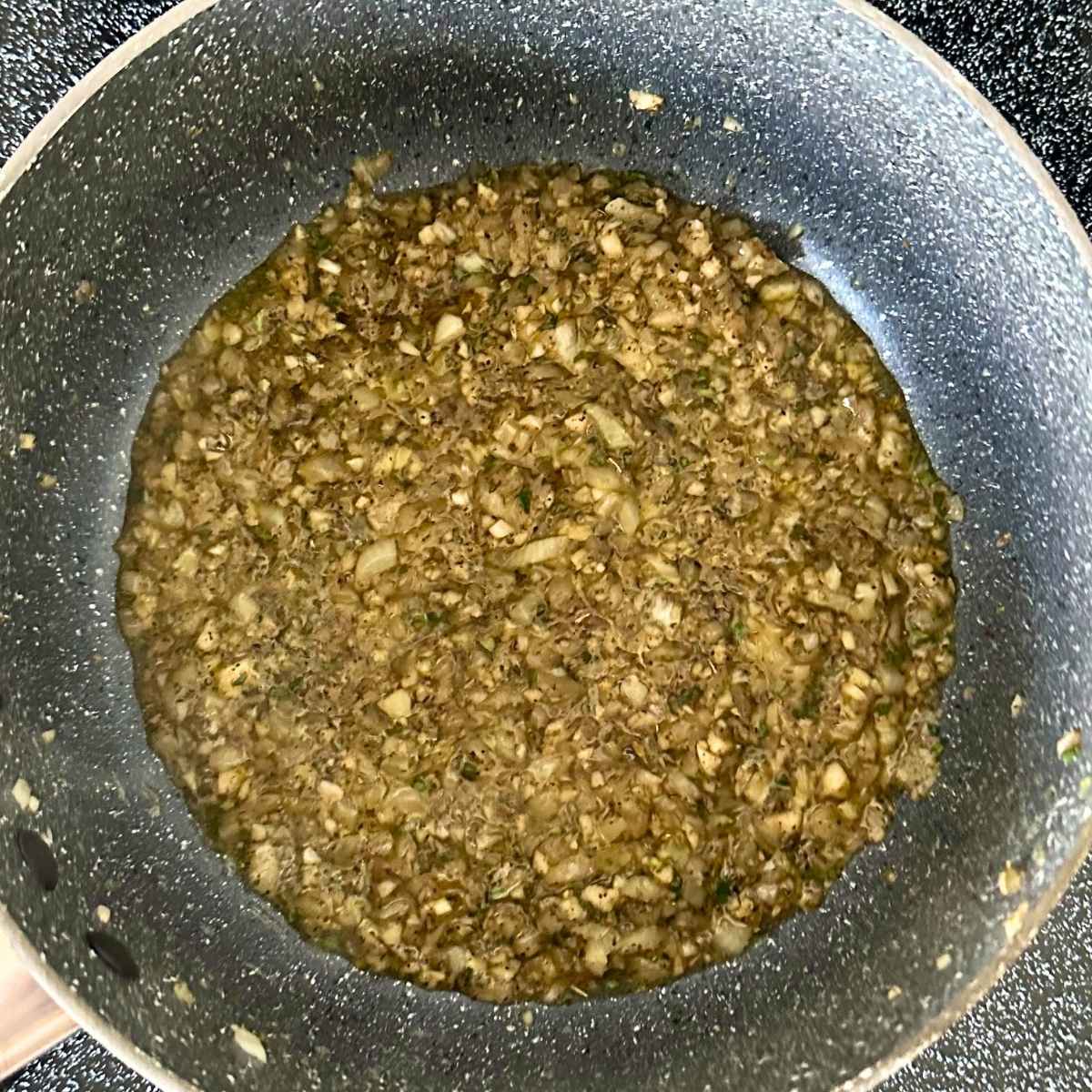 Cook onion, garlic, and rosemary in olive oil until fragrant.