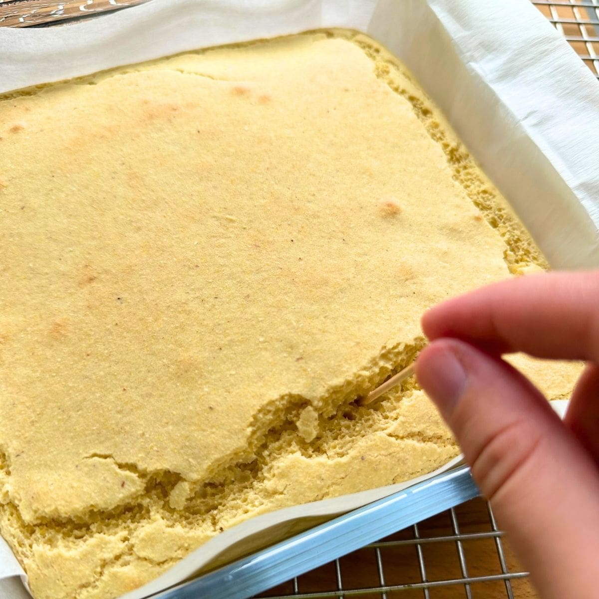 Test baked cornmeal with toothpick to see if it's done.