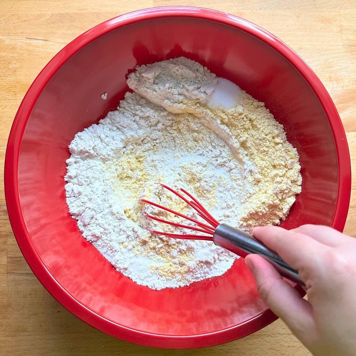 Whisk gluten-free flour and cornmeal with other dry ingredients in a large bowl.