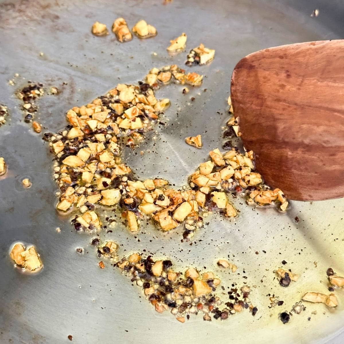 Sautéing garlic and black pepper.