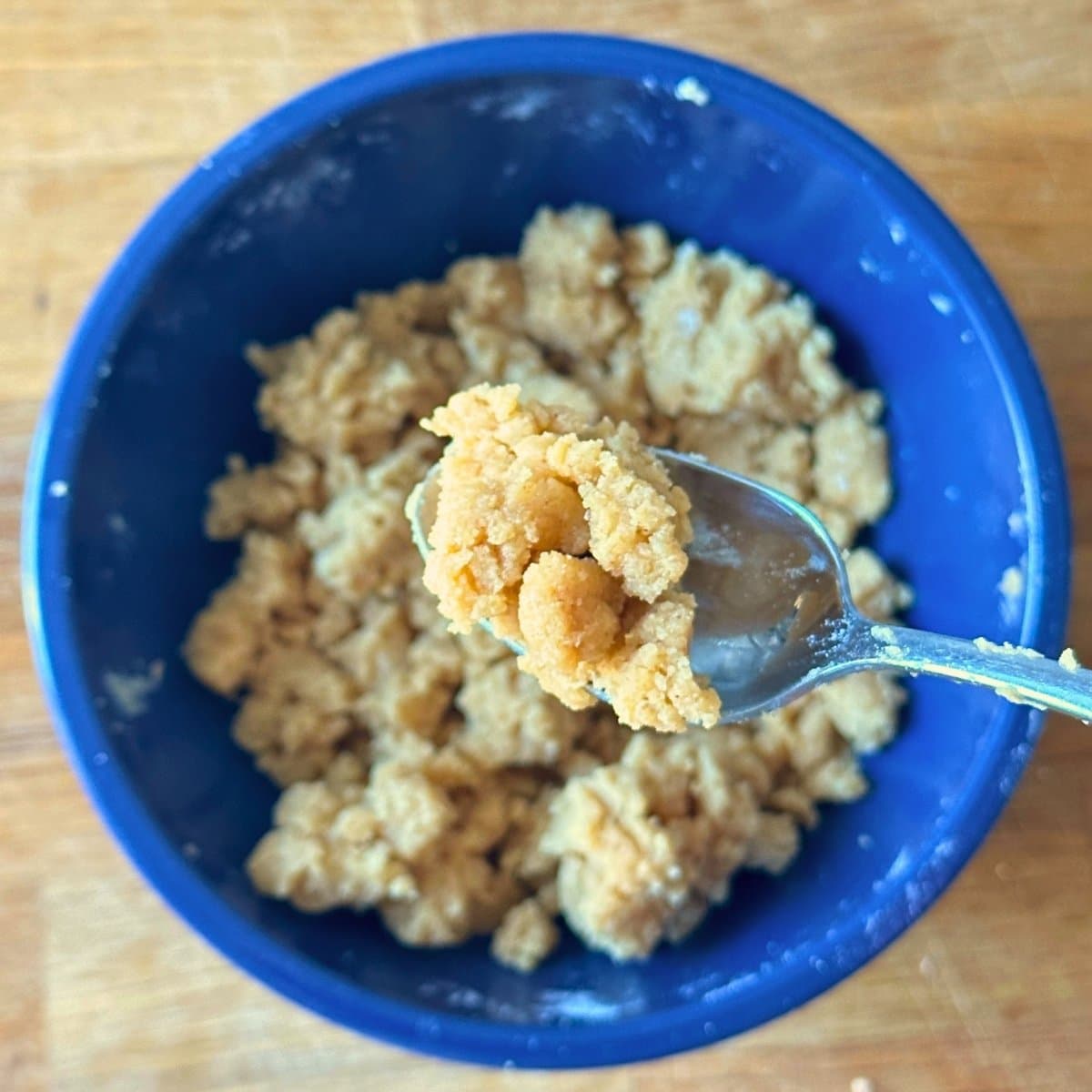 Streusel combined in a small bowl, crumbly in texture.